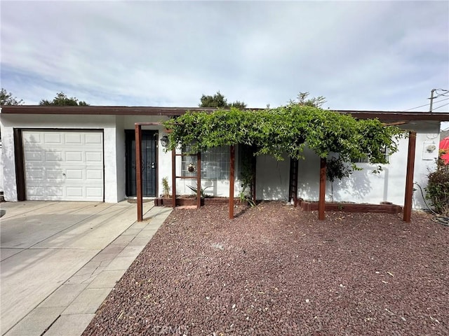 ranch-style home featuring a garage