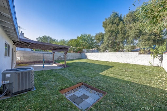 view of yard featuring central air condition unit and a patio