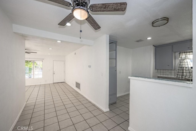 interior space featuring ceiling fan