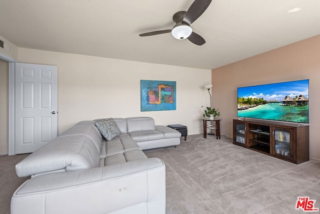 carpeted living room featuring ceiling fan