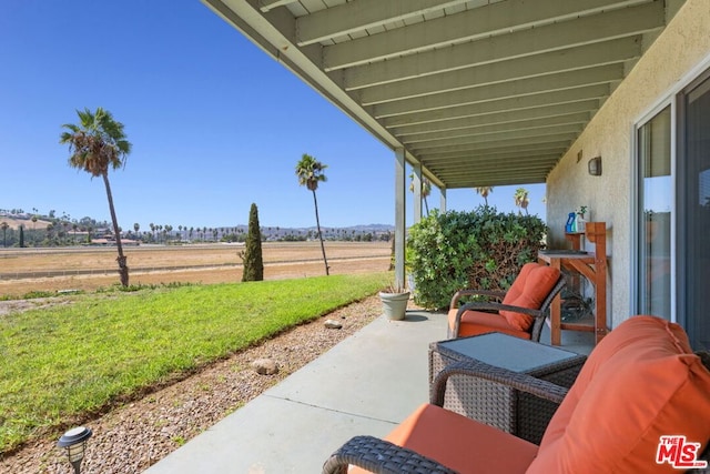 view of patio / terrace featuring a rural view