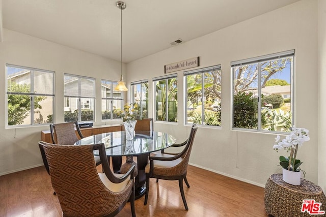 dining room with hardwood / wood-style flooring