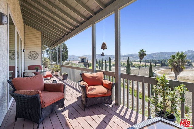 wooden terrace with a mountain view