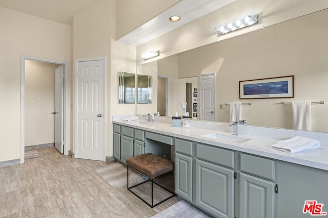 bathroom featuring hardwood / wood-style flooring and vanity