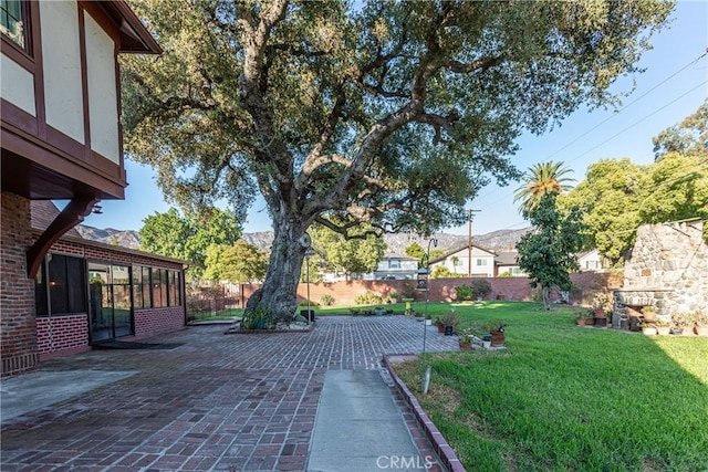 view of yard with a sunroom