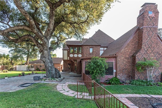 exterior space featuring a patio and a front yard