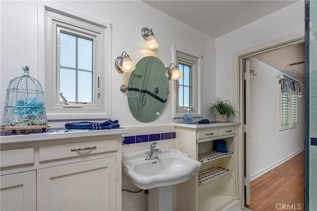 bathroom with hardwood / wood-style floors and sink