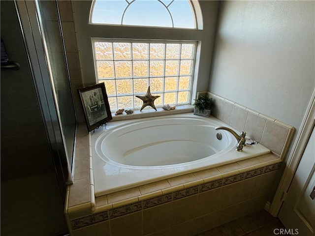 bathroom with tiled tub