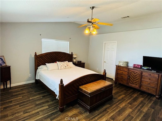 bedroom featuring ceiling fan, dark hardwood / wood-style flooring, and lofted ceiling