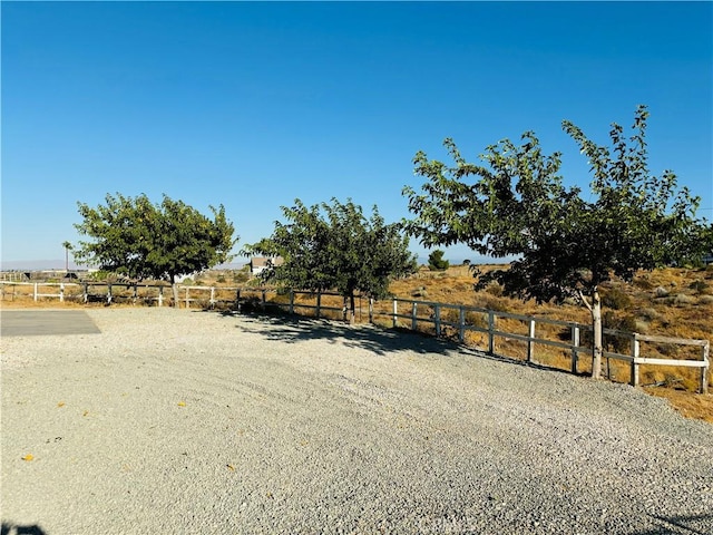 view of yard with a rural view