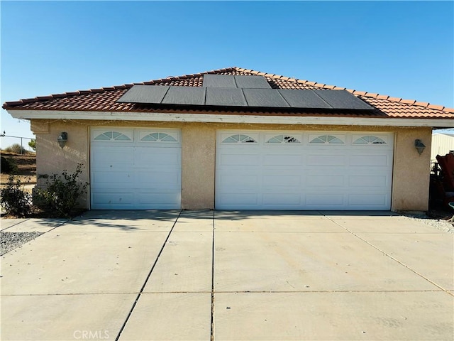 garage featuring solar panels