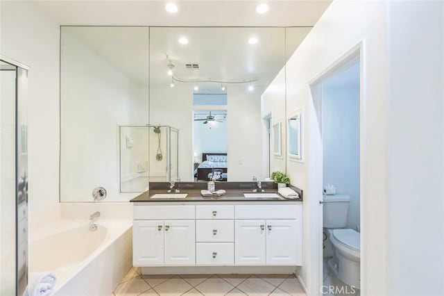 full bathroom with tile patterned flooring, ceiling fan, vanity, and toilet