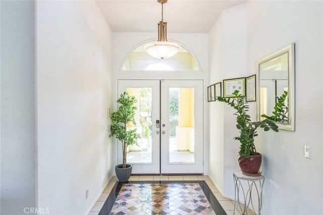 tiled entrance foyer featuring french doors