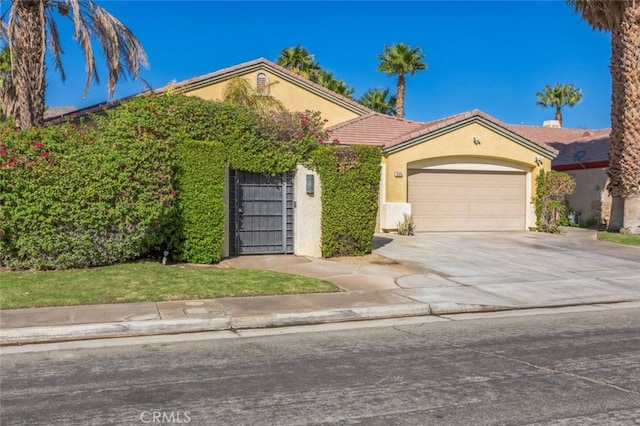 view of front facade with a garage and a front yard