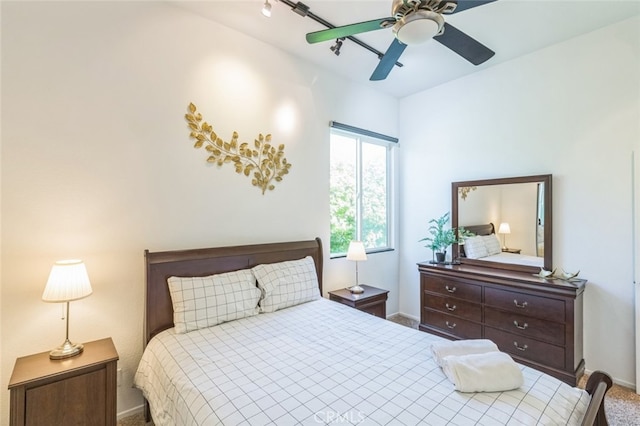 bedroom featuring ceiling fan, carpet flooring, and rail lighting