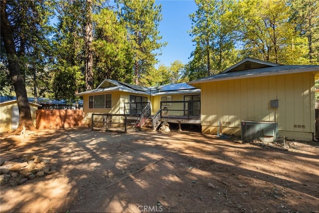 6131 Dana Cir, Magalia, CA 95954 - back of property with roof mounted solar panels and a deck