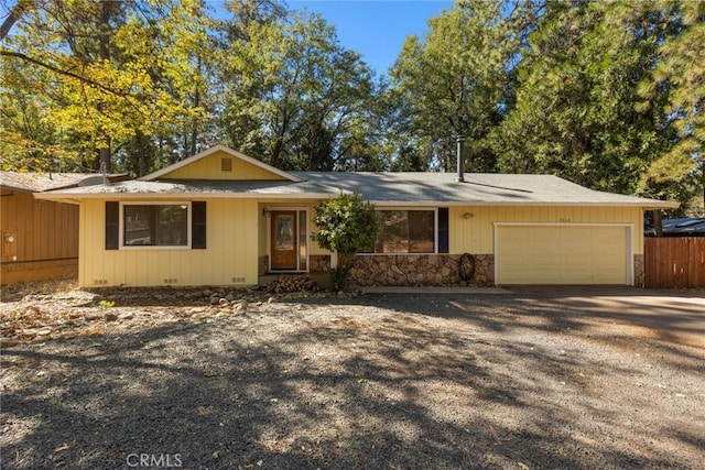 single story home featuring a garage