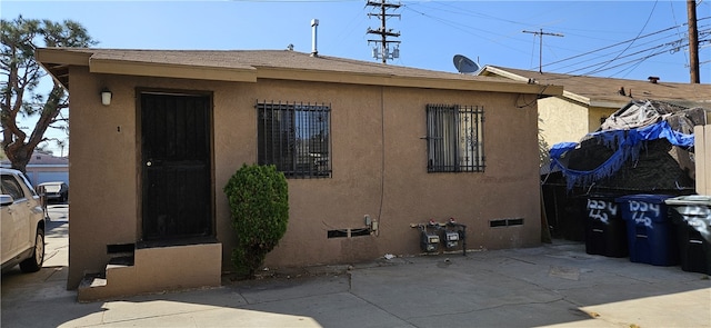 view of side of property featuring a patio