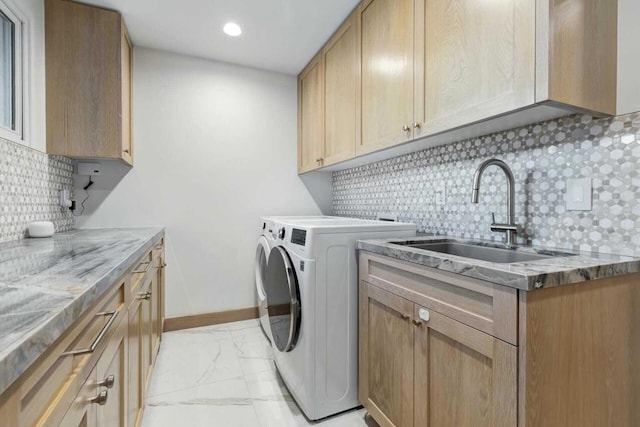 laundry room with cabinets, sink, and washing machine and clothes dryer