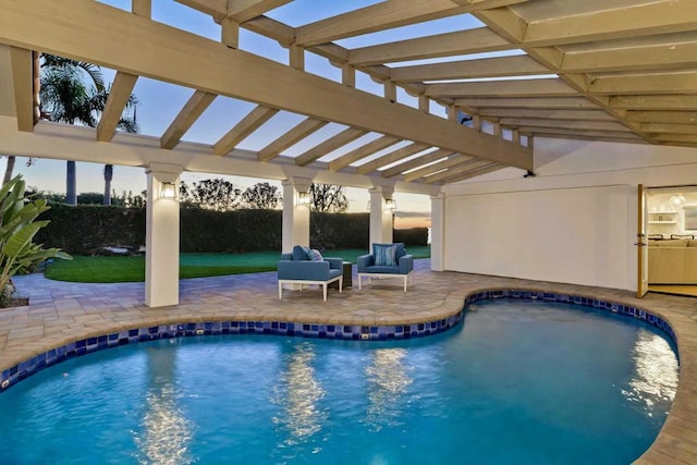 view of pool with a pergola, outdoor lounge area, and a patio