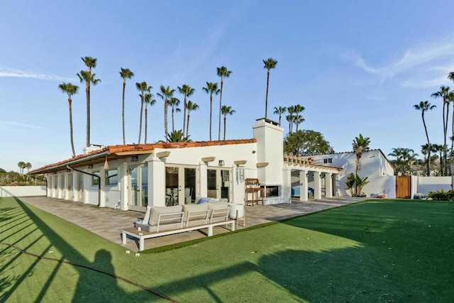 back of house with a patio area