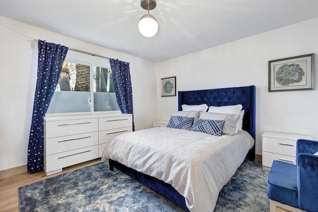 bedroom with wood-type flooring