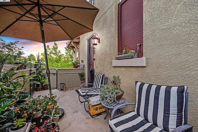 view of patio terrace at dusk