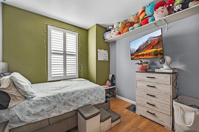 bedroom with light wood-type flooring