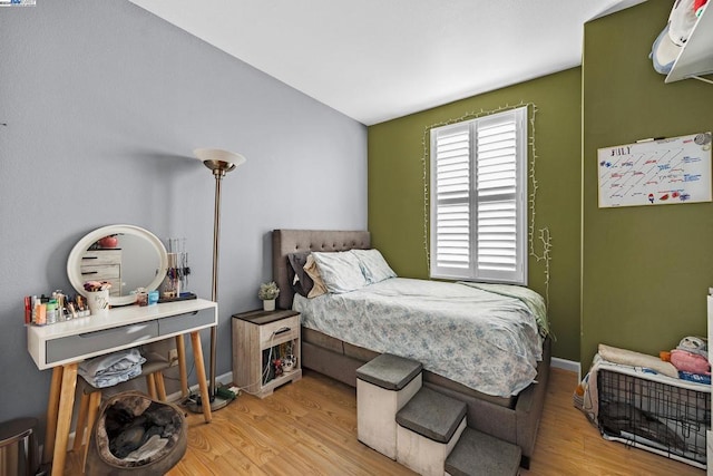 bedroom with light hardwood / wood-style floors