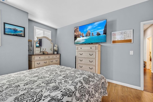 bedroom with light wood-type flooring