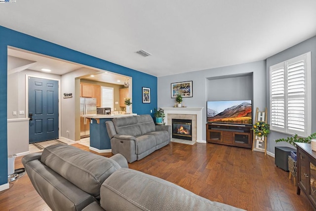 living room featuring a wealth of natural light and hardwood / wood-style floors