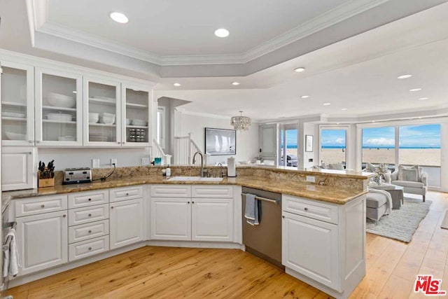 kitchen featuring dishwasher, light hardwood / wood-style flooring, sink, and white cabinetry