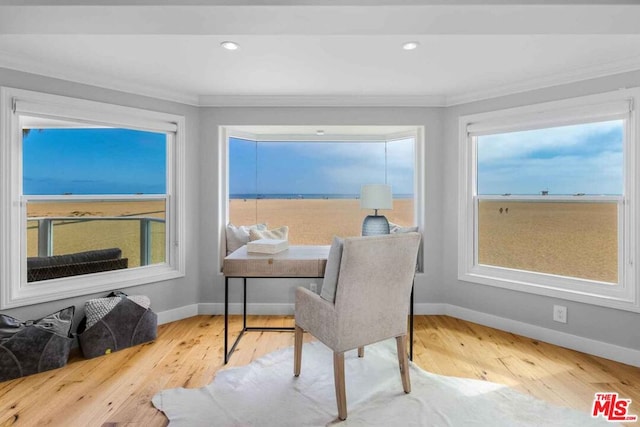 home office featuring hardwood / wood-style flooring and ornamental molding