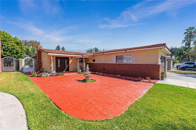 ranch-style house with a front yard and a garage