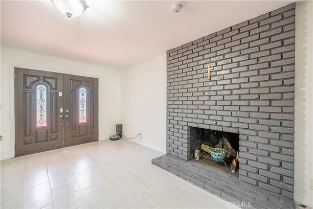 foyer entrance with a fireplace