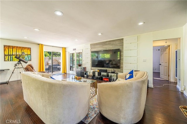 living room with dark hardwood / wood-style flooring