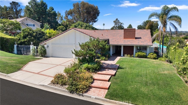 ranch-style home featuring a garage and a front yard