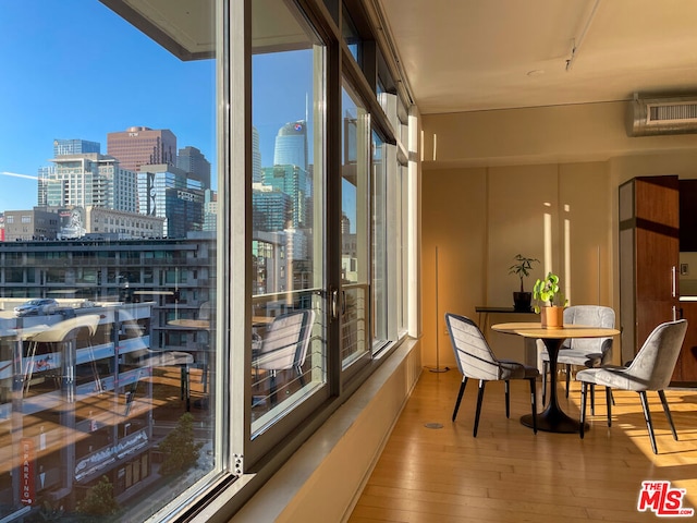 dining room with hardwood / wood-style flooring