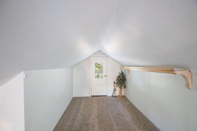 bonus room featuring carpet floors and lofted ceiling