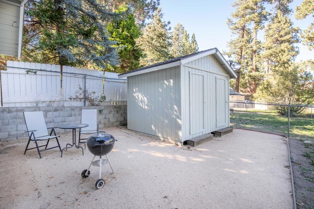 view of outbuilding featuring an outdoor fire pit