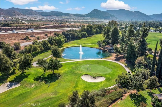 aerial view featuring a water and mountain view