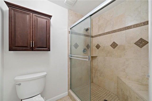 bathroom with toilet and walk in shower