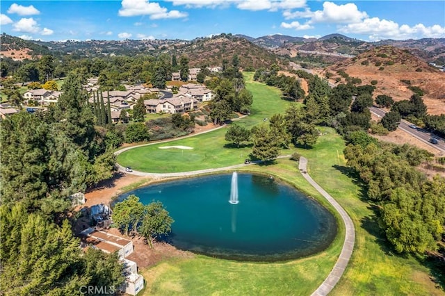 drone / aerial view featuring a water and mountain view