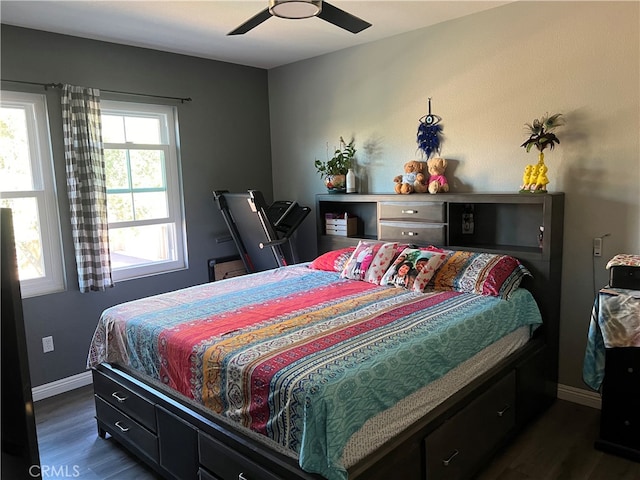 bedroom featuring ceiling fan and dark hardwood / wood-style floors