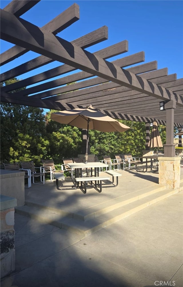 view of community with a pergola and a patio area