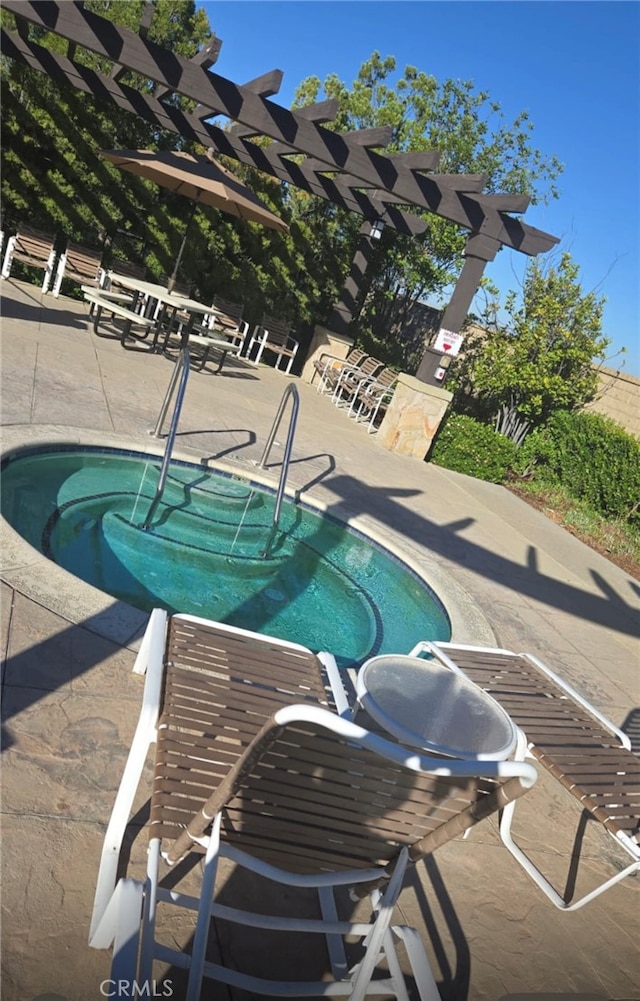 view of pool featuring a pergola and a patio area