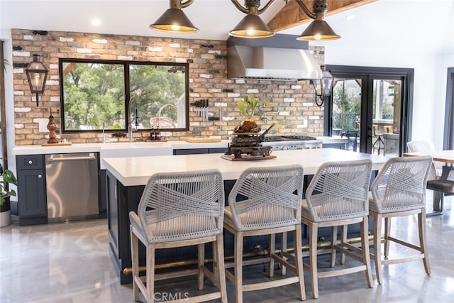 kitchen with decorative backsplash, dishwasher, wall chimney range hood, and a wealth of natural light