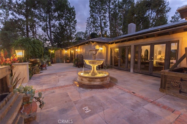 patio terrace at dusk with french doors