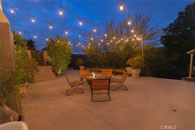 patio at night with a fire pit