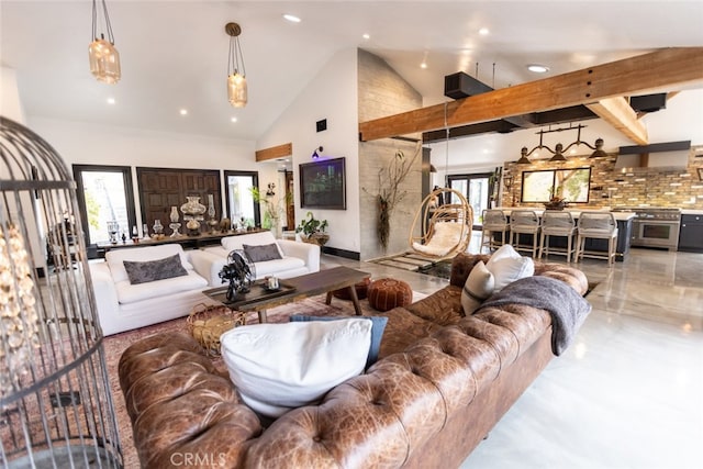 living room featuring beamed ceiling and high vaulted ceiling